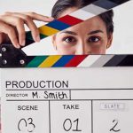 portrait-of-female-videographer-holding-clapper-picture-small
